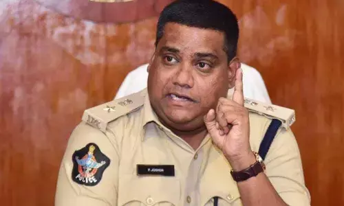 Krishna district SP P Joshua addressing a press conference in Vijayawada on Tuesday