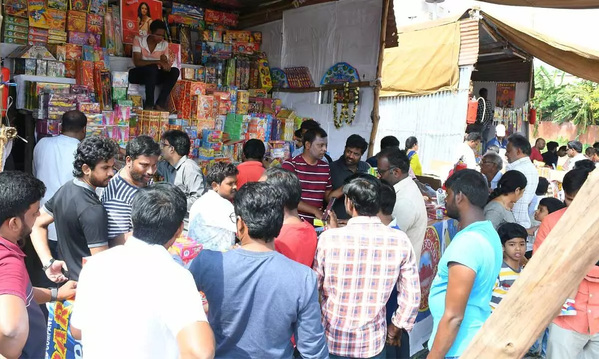 People purchasing firecrackers on the eve of Diwali festival in Vijayawada on Saturday Photo: Ch Venkata Mastan