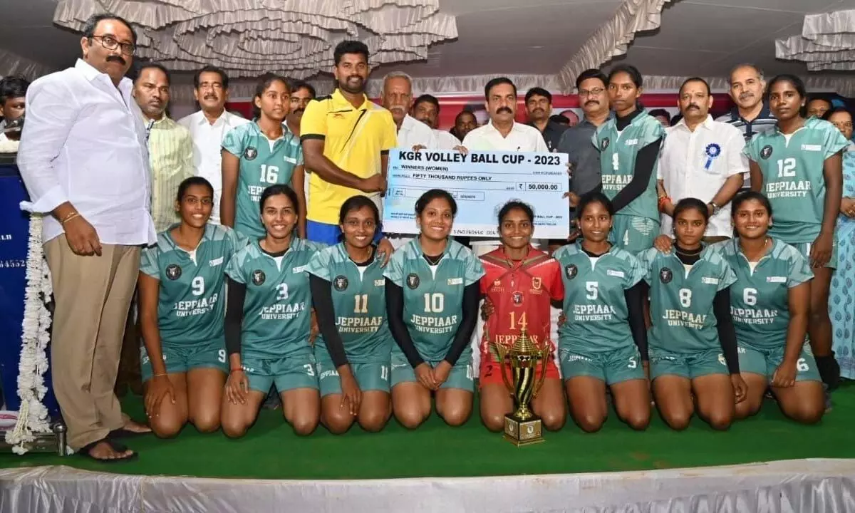 Agriculture Minister Kakani Govardhan Reddy presenting prize cheque to the winners of KGR Volley Ball Tournament-2023 in Muthukuru mandal on Saturday