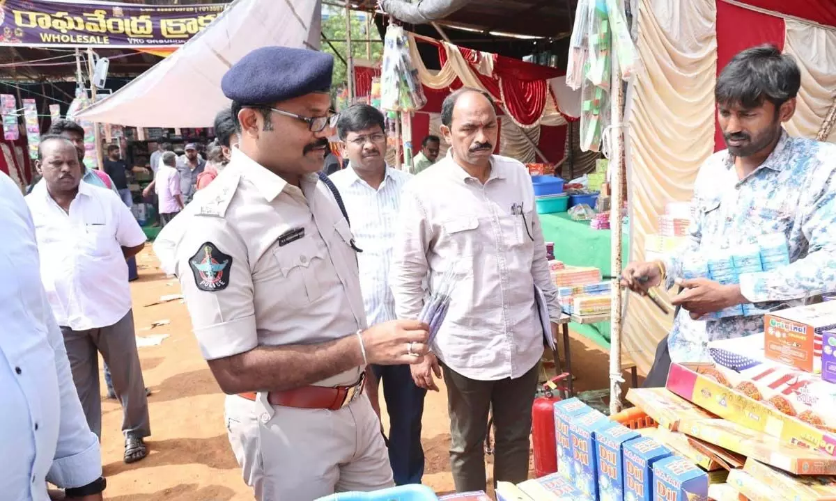 SP Dr K Tirumaleswara Reddy inspecting crackers at a shop set up at VRC Grounds in Nellore on Saturday