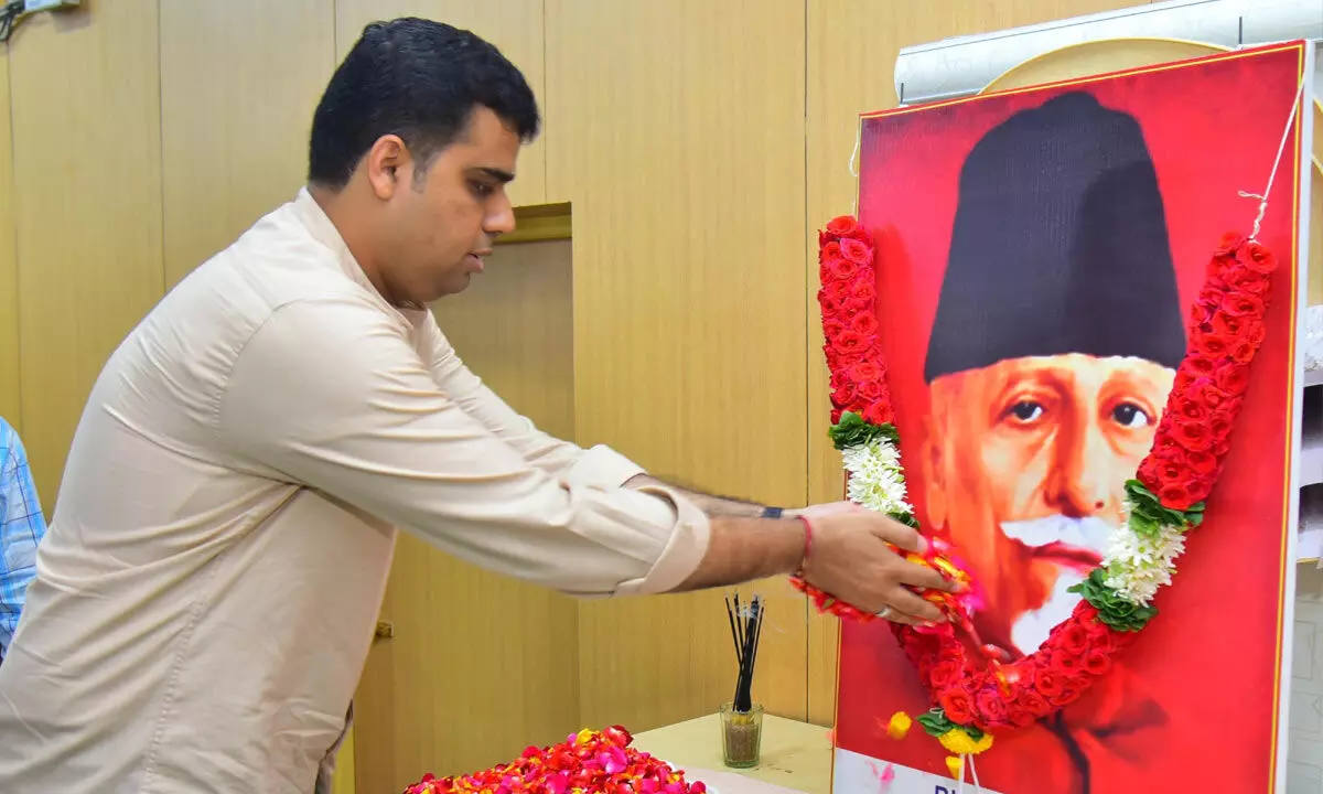 Joint Collector TS Chethan garlanding the portrait of freedom fighter Maulana Abul Kalam Azad at the Collectorate in Puttaparthi on Saturday