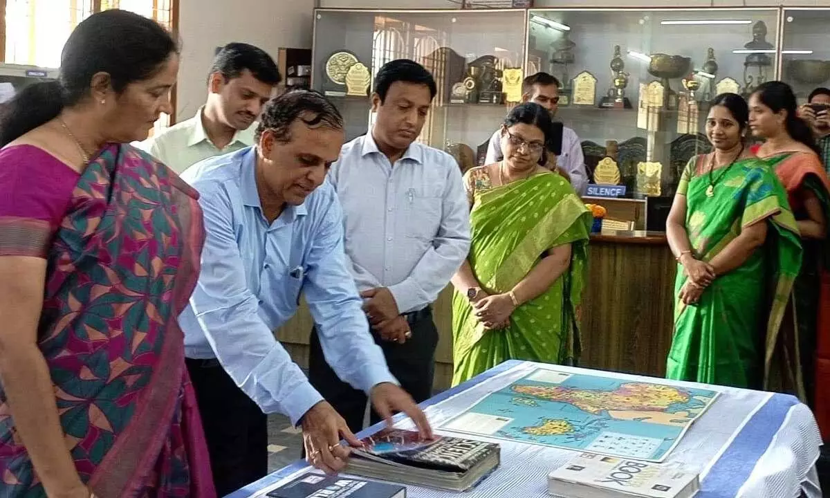 KCP Siddhartha Adarsh Residential Public School Convenor Veerpaneni Sasikala along with Principal and others at Book Exhibition at Kanuru on Tuesday