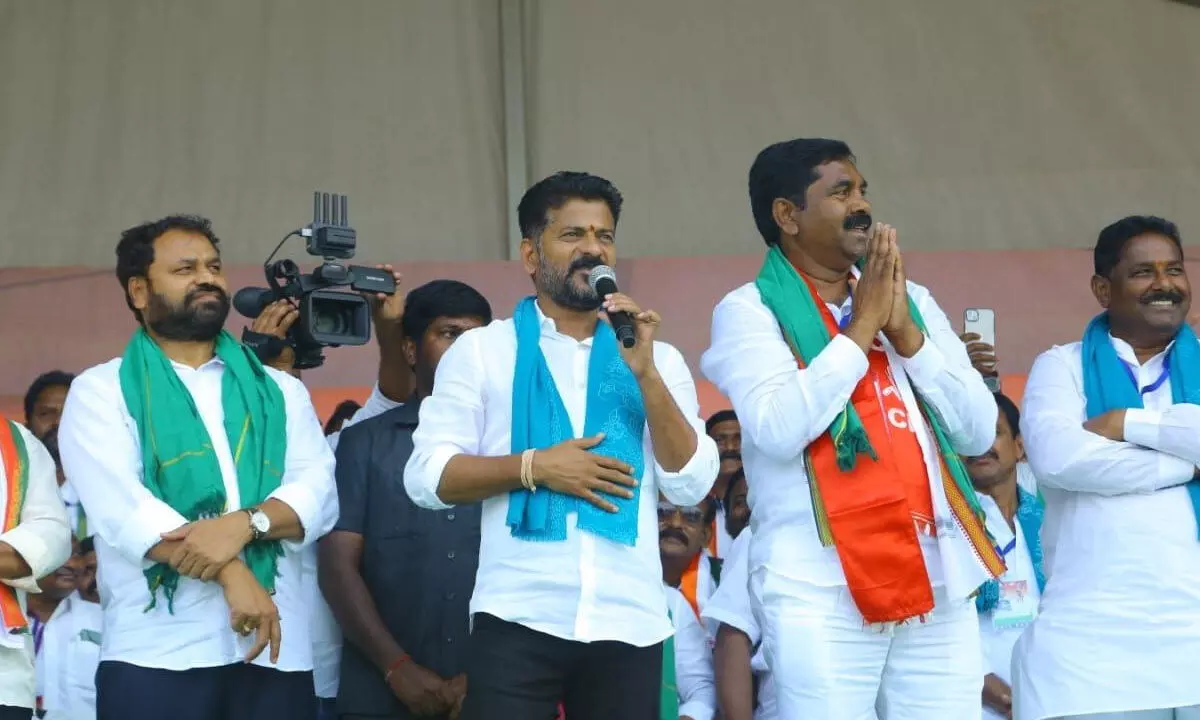 TPCC president A Revanth Reddy addressing a public meeting organised by Congress Wardhannapet candidate KR Nagaraju at Laxmipuram in Warangal district on Tuesday Photos: G Shyam Kumar