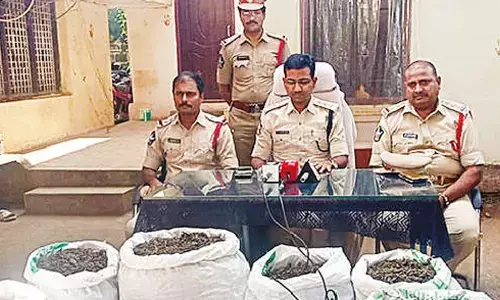 East Zone DSP N Kishore Kumar explaining to the media about the seizure of ganja in Rajamahendravaram on Saturday. Bommuru Inspector R Vijay Kumar and SI K Jaganmohan Rao are also seen.