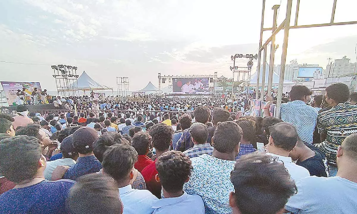 People at RK Beach enjoying watching the live screening of the World Cup semifinals on a big screen in Visakhapatnam. 					(Photo: Vasu Potnuru)