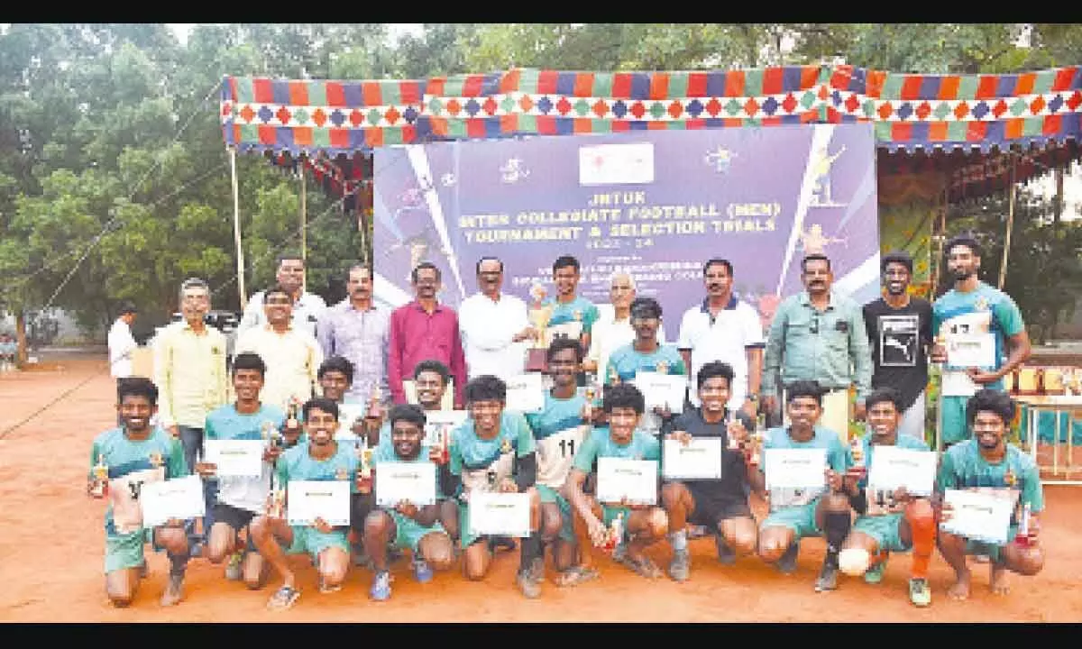 Students of Vishnu Institute of Technology, Bhimavaram with trophy after winning football tournament at VR Siddhartha Engineering College in Vijayawada on Sunday