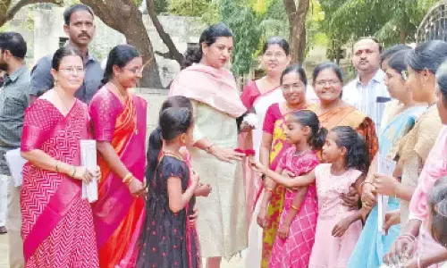 District Collector M Gautami with the children of Sishu Vihar and Bala Sadan at a  programme in Anantapur on Sunday