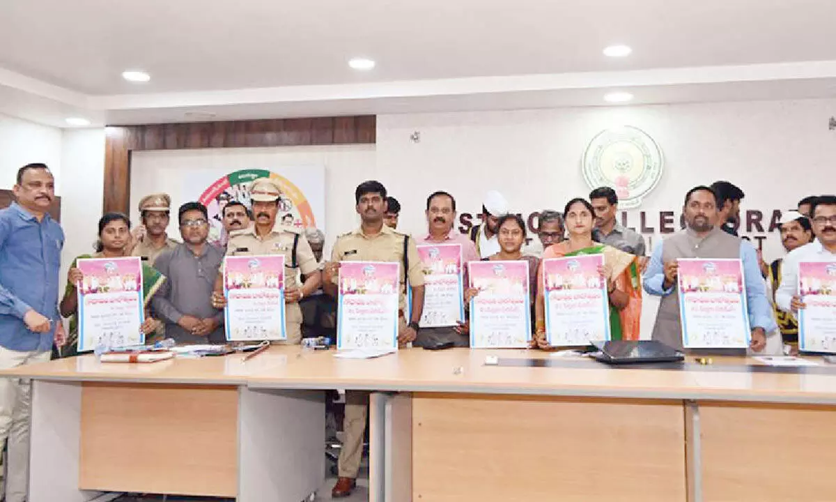 District Collector Dr K Madhavi Latha, Joint Collector N Tej Bharat, SP P Jagadeesh and others unveiling Balotsavam posters at her office in Rajamahendravaram on Monday