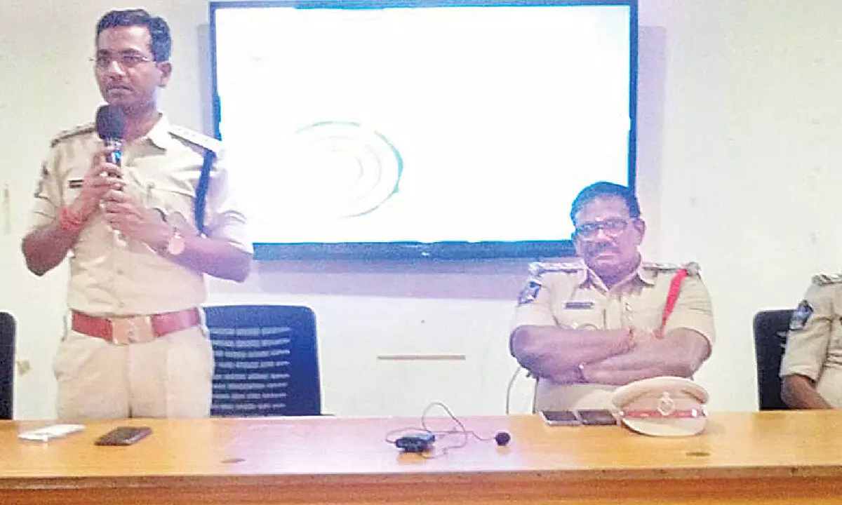 East Zone DSP Dr M Kishore Kumar speaking at an awareness programme on the prevention of cybercrimes at GIET in Rajamahendravaram on Monday