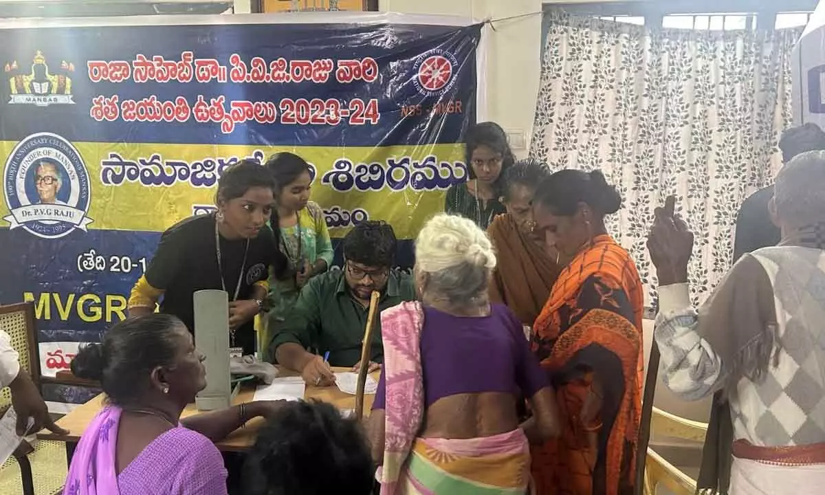 Doctors examining patients at medical camp MVGR College at Dwarapudi village
