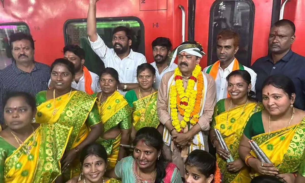 BJP MP G V L Narasimha Rao flags off the Visakhapatnam-Varanasi express train in Visakhapatnam on Tuesday