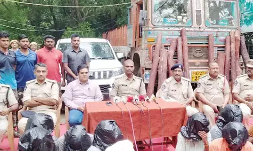 Task force officials producing the accused before the media in Tirupati on Monday