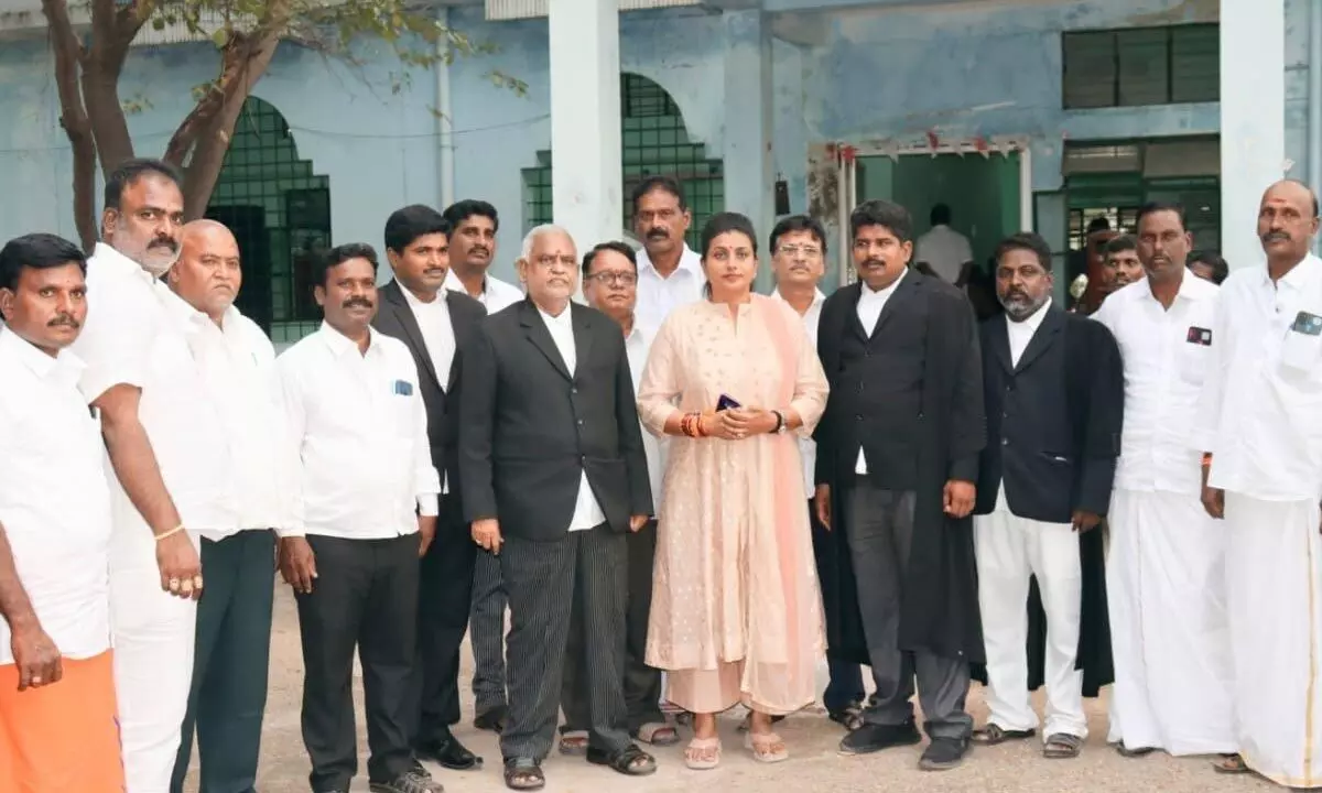 Minister R K Roja with her lawyers at the Nagari court on Tuesday