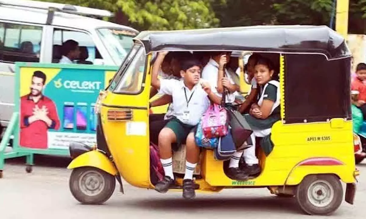An auto-rickshaw overloaded with schoolchildren