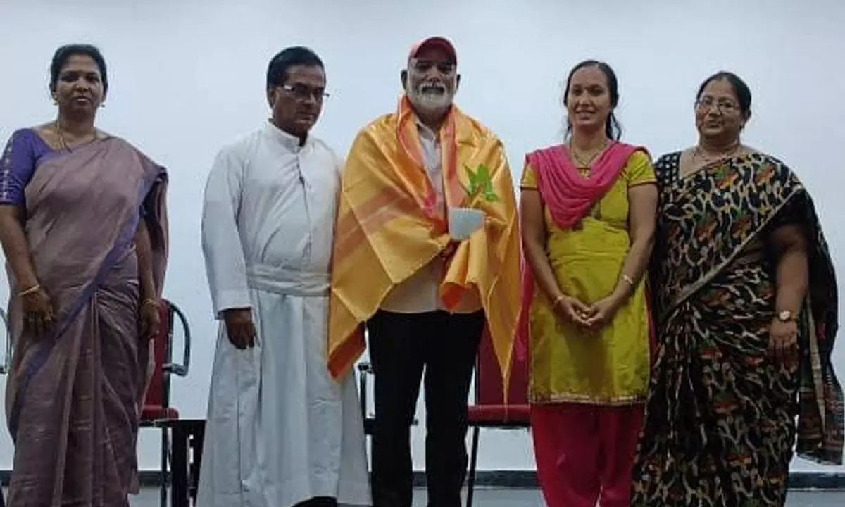 Yoga coach L Murali Krishna being felicitated at Andhra Loyola College in Vijayawada on Wednesday