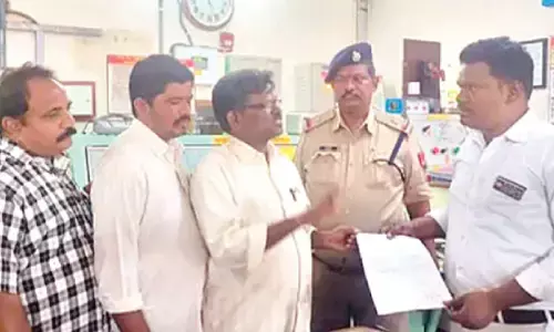 CITU district general secretary MD Anji Babu submitting a memorandum to Kurnool railway station manager on Saturday