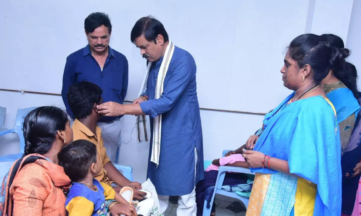 BJP MP G V L Narasimha Rao with beneficiaries at the camp held for physically challenged persons in Visakhapatnam on Tuesday