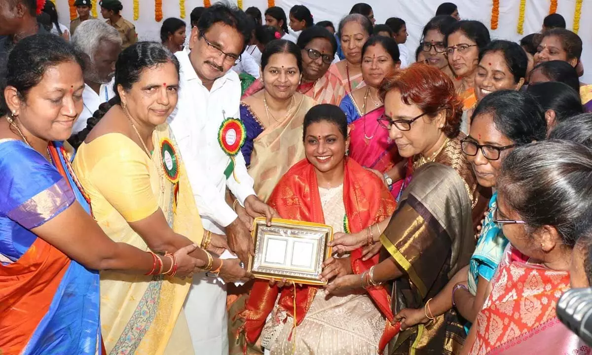 Tourism Minister R K Roja being felicitated at the alumni meet of Sri Padmavathi Womens Degree and PG College in Tirupati on Tuesday