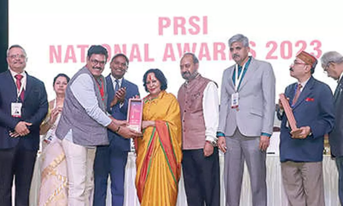 PRSI Tirupati chapter chairman Srinivasa Rao receiving the award in New Delhi