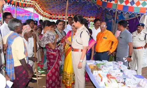 District SP M Deepika interacts with tribals at the medical camp at Konda Linga Valasa village in Mentada mandal on Thursday