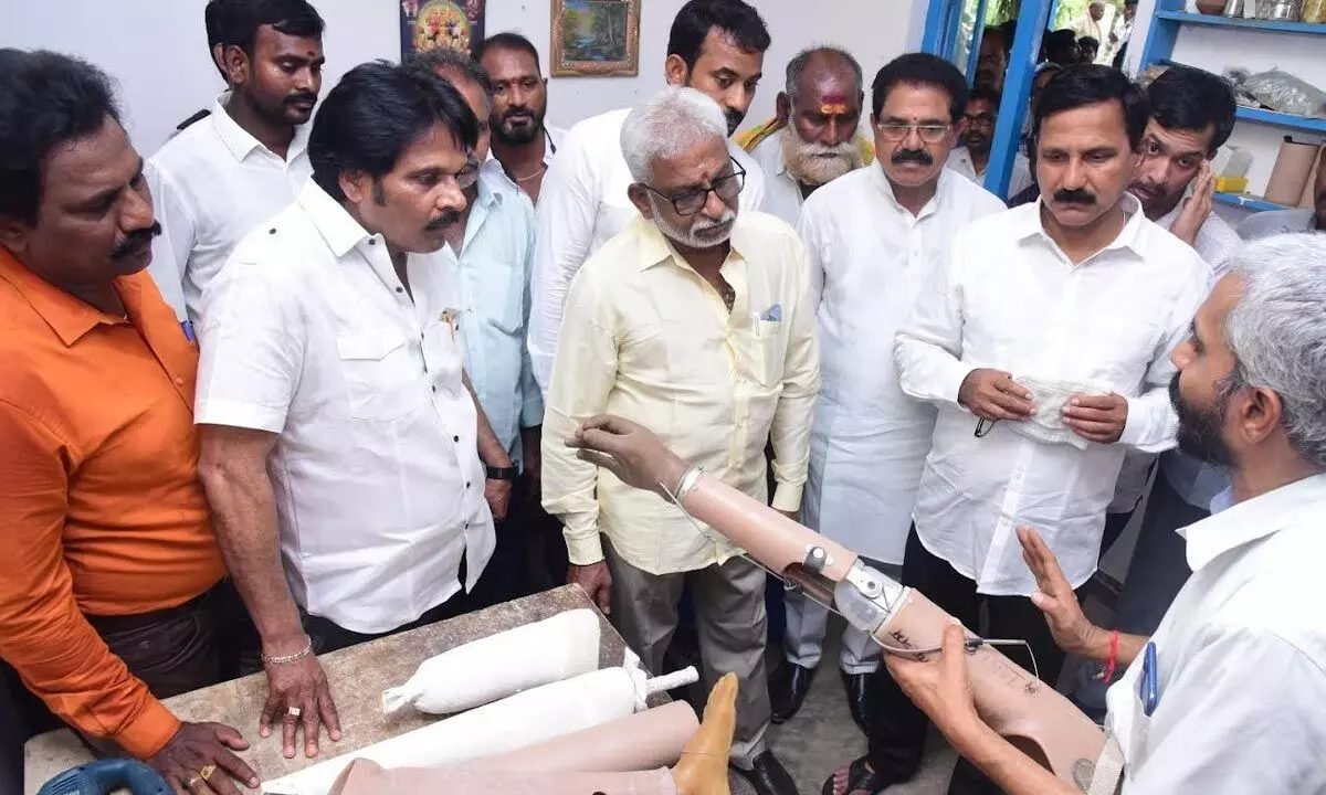 Sri Gurudeva Charitable Trust chairman Raparthi Jagadeesh Babu explaining details of artificial limbs to YSRCP regional coordinator Y V Subba Reddy, MP M V V Satyanarayana among others in Vizianagaram