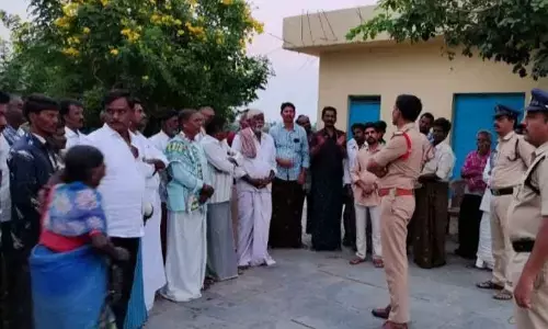 Udumulapadu villagers complaining to the police about pig menace