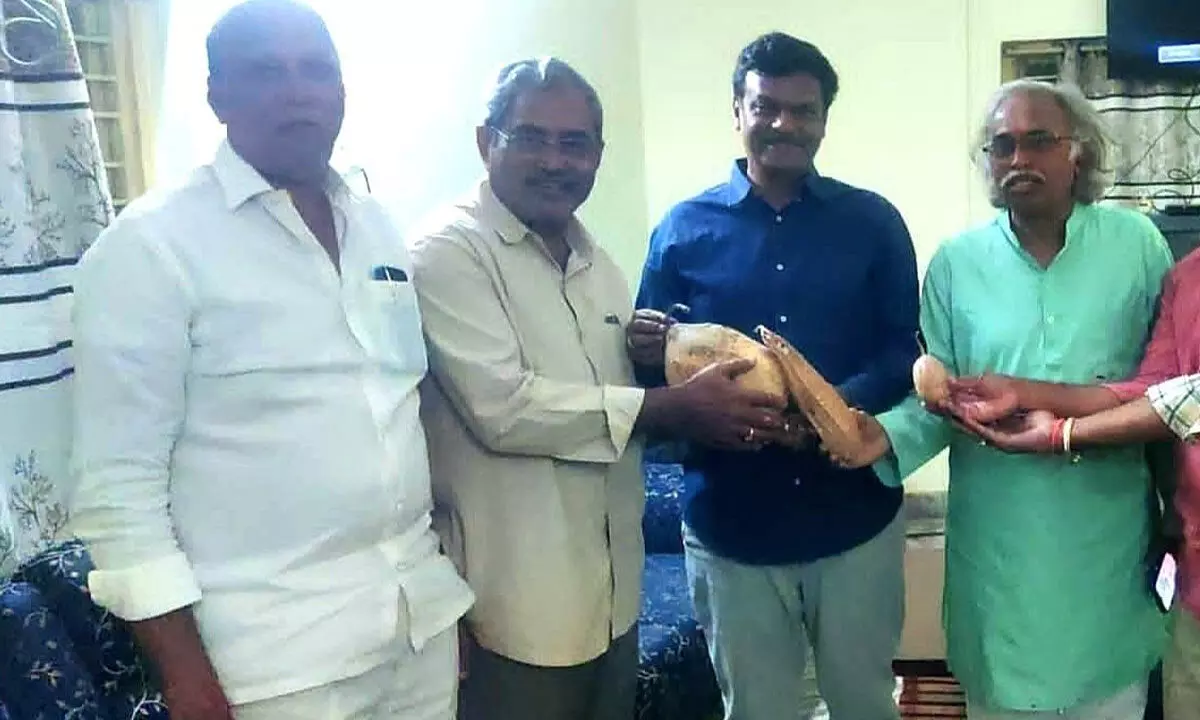 Farmers exchanging seeds in the presence of former MLC P V N Madhav in Visakhapatnam on Monday