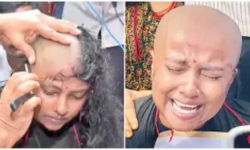 Deprived woman candidate protests by tonsuring head