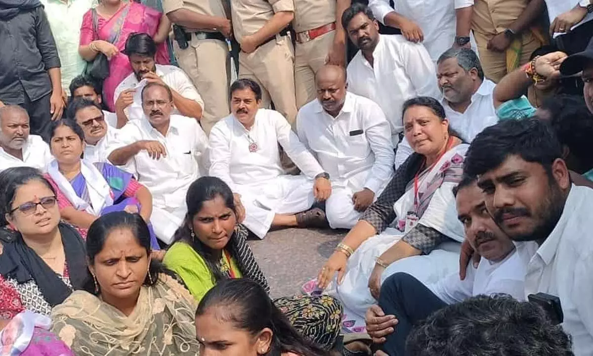 Squatting on the road, JSP leaders staging a protest in Visakhapatnam on Monday