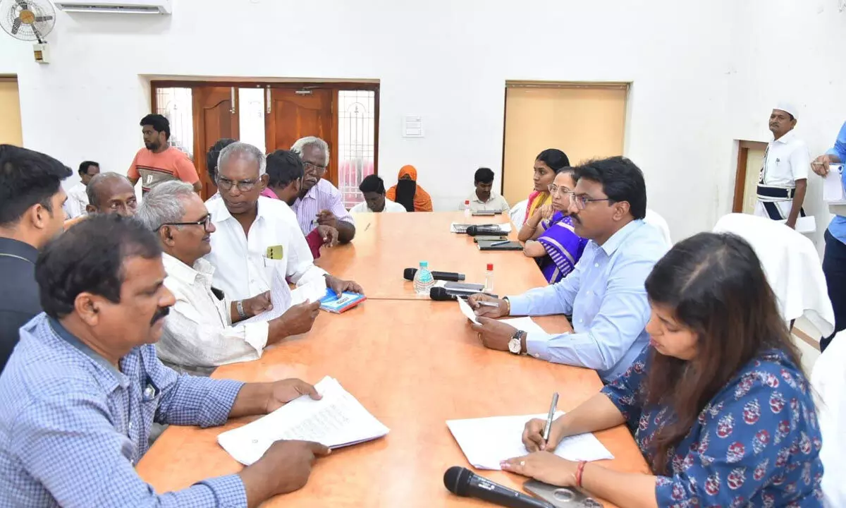 Krishna District Collector P Raja Babu receives applications at Spandana programme in Machilipatnam on Monday