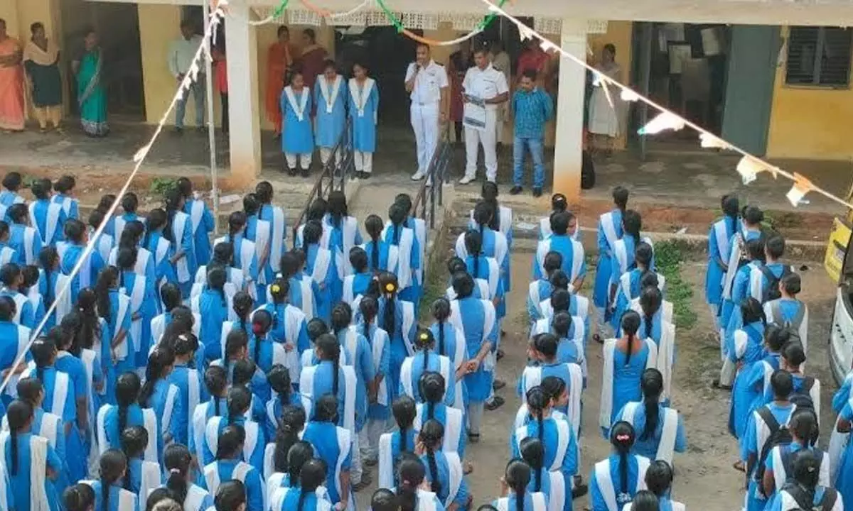 Navy officers delivering a motivational talk at an educational institution and motivating students to join the Armed Forces