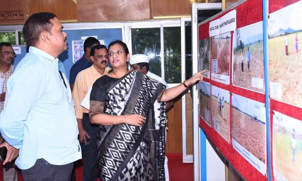 District Collector M Gautami explaining the drought conditions with the help of a photo exhibition to the Inter-Ministerial Central team headed by Pankaz Yadav, joint secretary, DAFW, in Anantapur on Tuesday