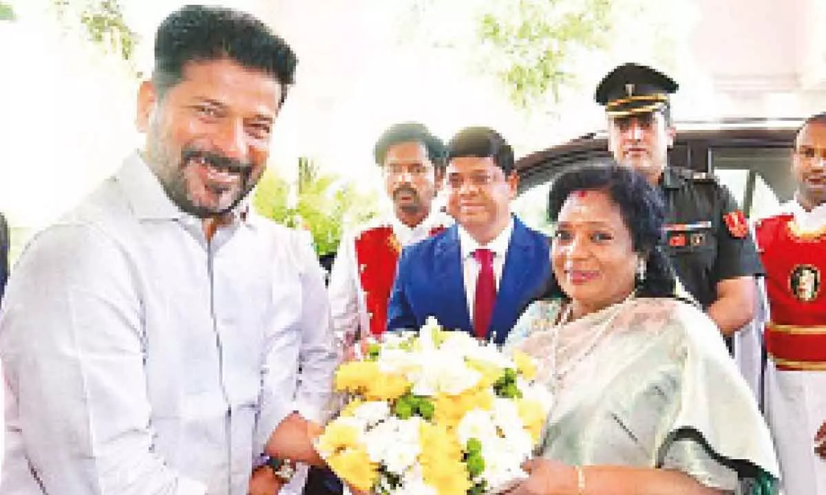 Telangana Governor Tamilisai Soundararajan being welcomed by Chief Minister Revanth Reddy on her arrival to address the Telangana Assembly, in Hyderabad on Friday