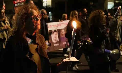 Israeli hostages killed in Gaza were holding white flag, official says