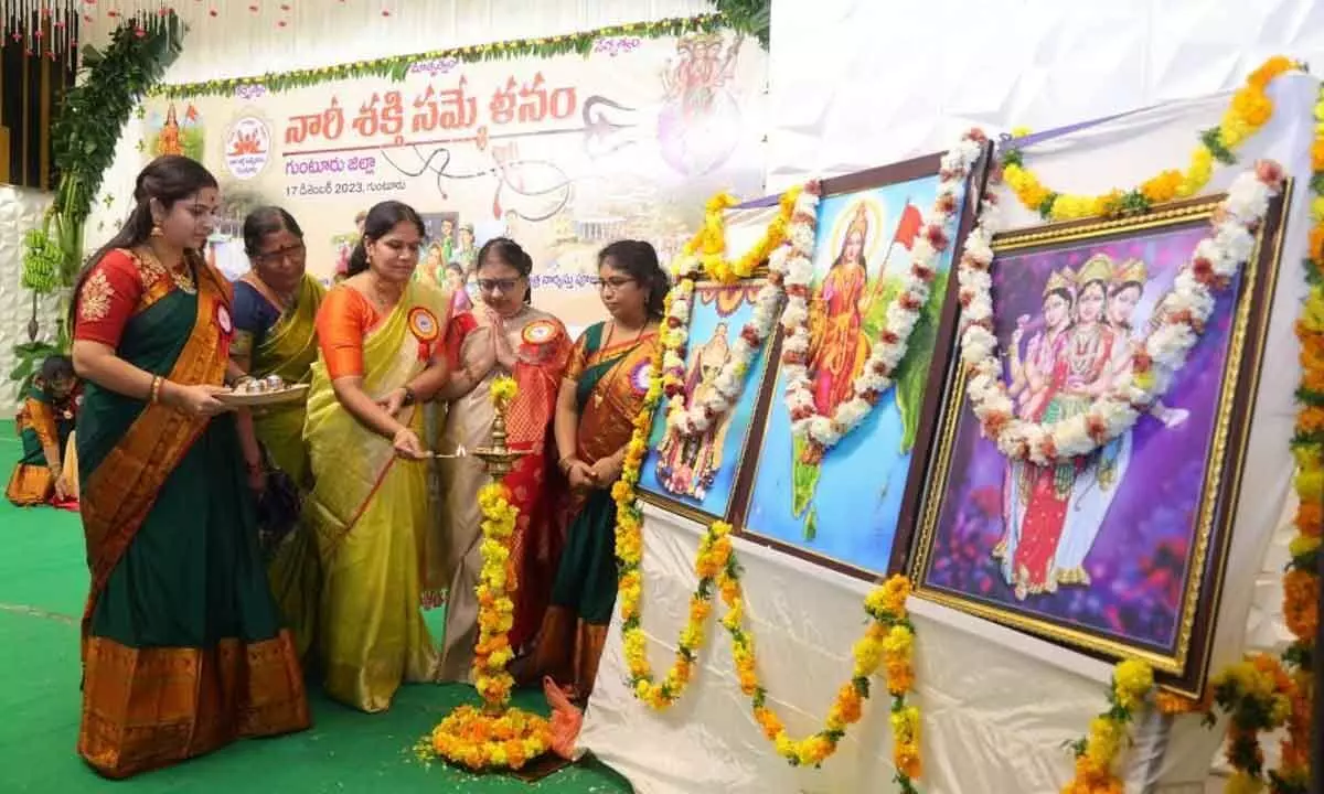 Nari Shakthi state coordinator Sadineni Yamini Sharma, GST Guntur -II joint commissioner Dasari Naga Jyothi, Transport department joint commissioner Krishna Veni lighting the lamp in Guntur on Sunday