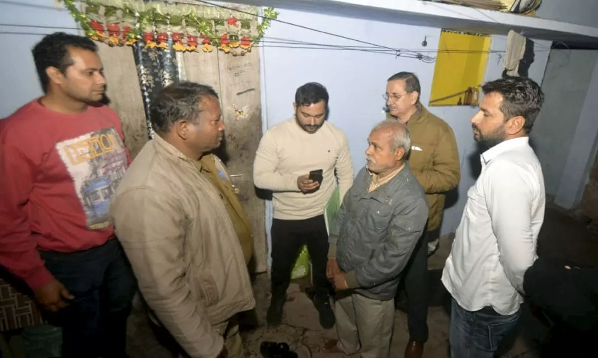 Delhi Police personnel during their investigation at the house of Sagar Sharma, an accused of Parliament security breach, in Lucknow 0n Sunday