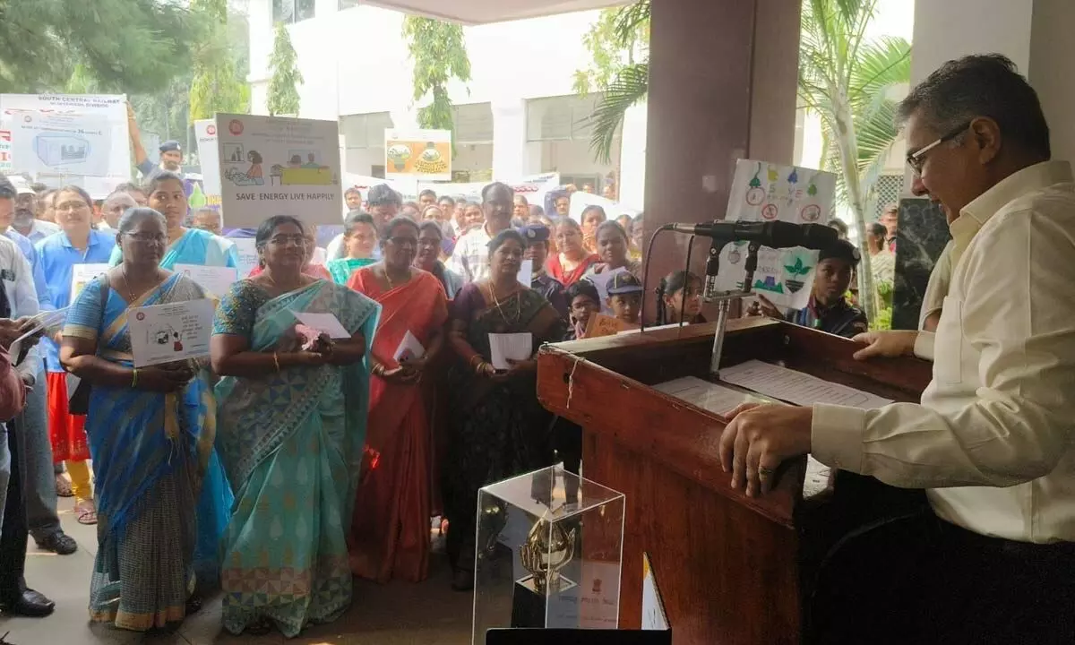 Divisional Railway Manager Narendra A Patil administering energy conservation pledge to the staff of the divisional office in Vijayawada on Monday