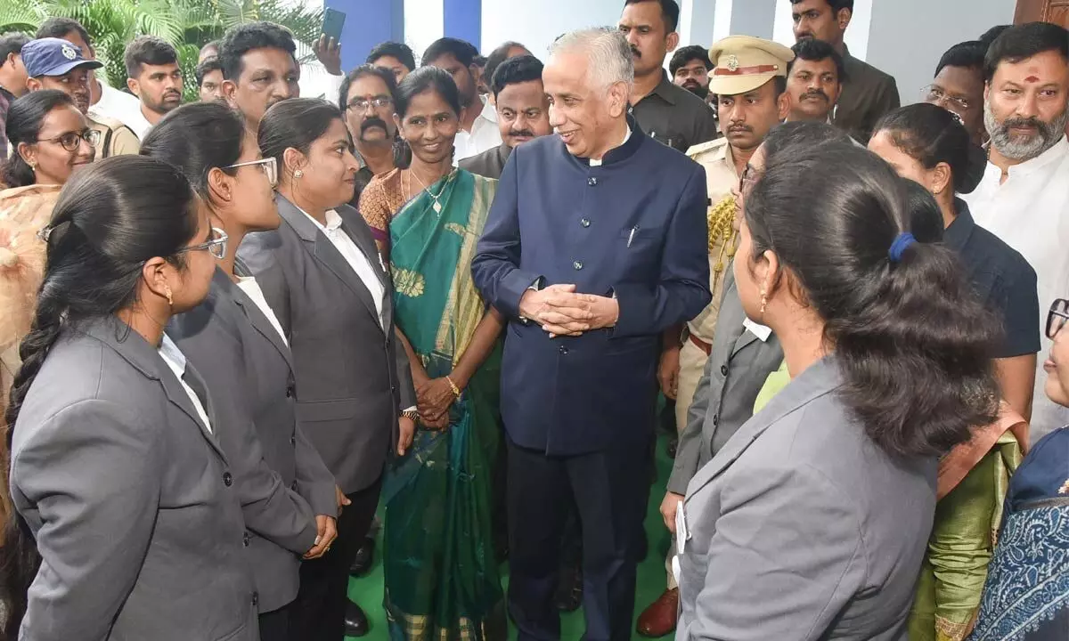 Governor S Abdul Nazeer interacts with girl students during the Viksit Bharat Sankalp Yatra programme at Sri Padmavati Mahila University in Tirupati on Monday