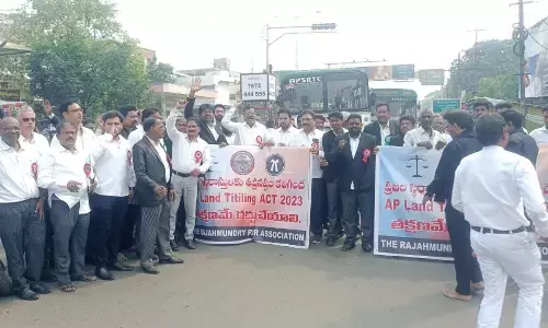 Lawyers protesting at Kotipalli bus stand centre against  AP Land Titling  Act