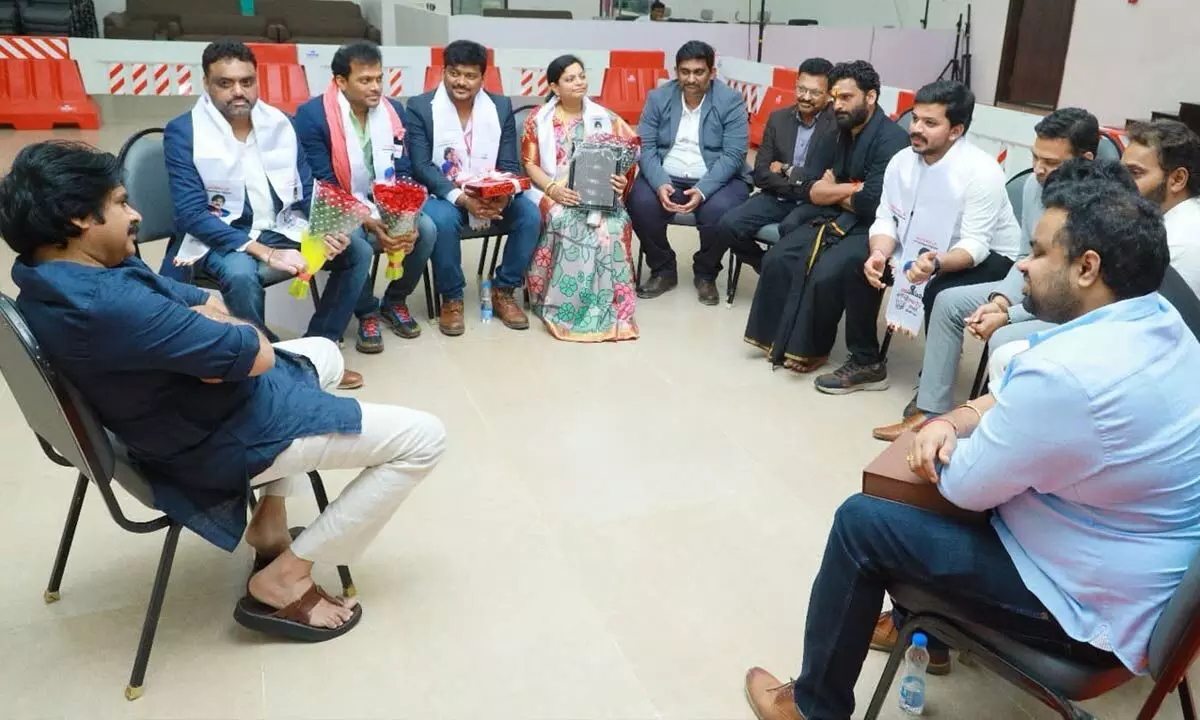 Jana Sena chief Pawan Kalyan meeting a group of NRIs at party headquarters in Mangalagiri on Tuesday