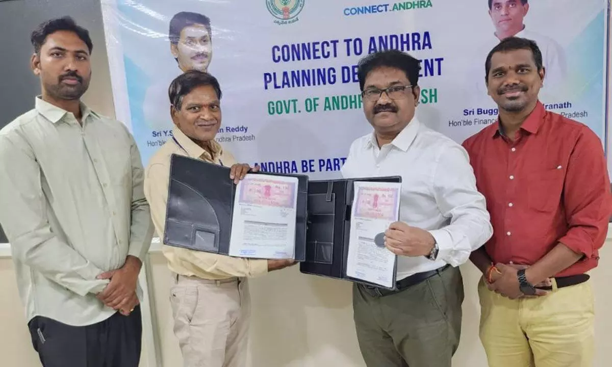 Power Grid Corporation of India Senior GM Naga Mohana Rao and Connect to Andhra Director Shiva Sankara Rao exchanging MoU in Vijayawada on Tuesday