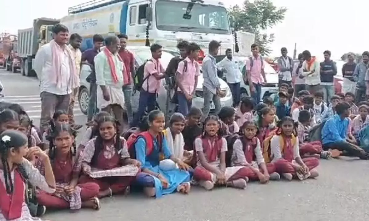 Schoolchildren protesting in Kodangal demanding bus service to the village to facilitate timely travel for school hours