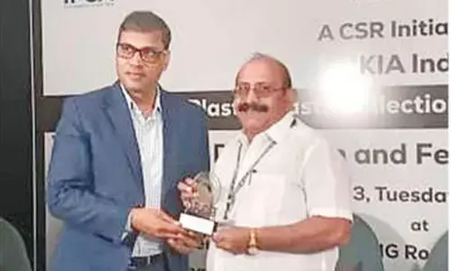 Headmaster of MK Baig VMC School S Imam Basha receiving the award in Vijayawada on Tuesday
