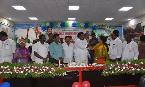 Minister Merugu Nagarjuna sharing a piece of cake with Ongole mayor Gangada Sujatha at Semi Christmas celebrations at collectorate on Thursday