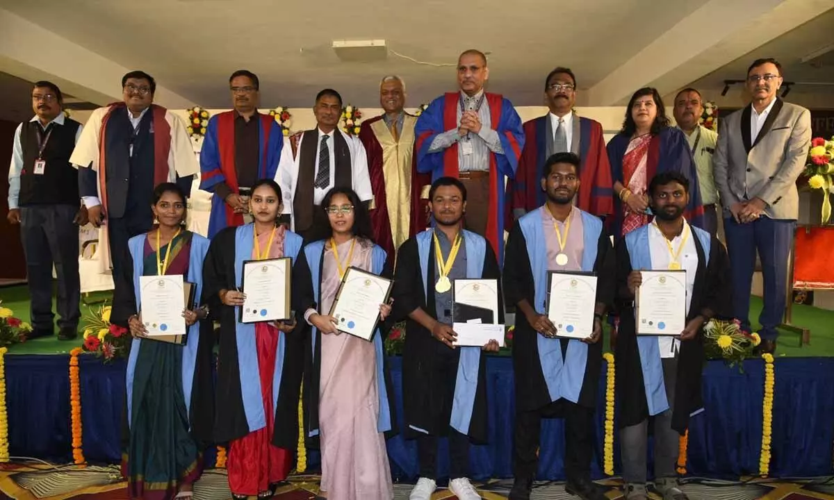 Prof GSN Raju with the students who completed their graduation