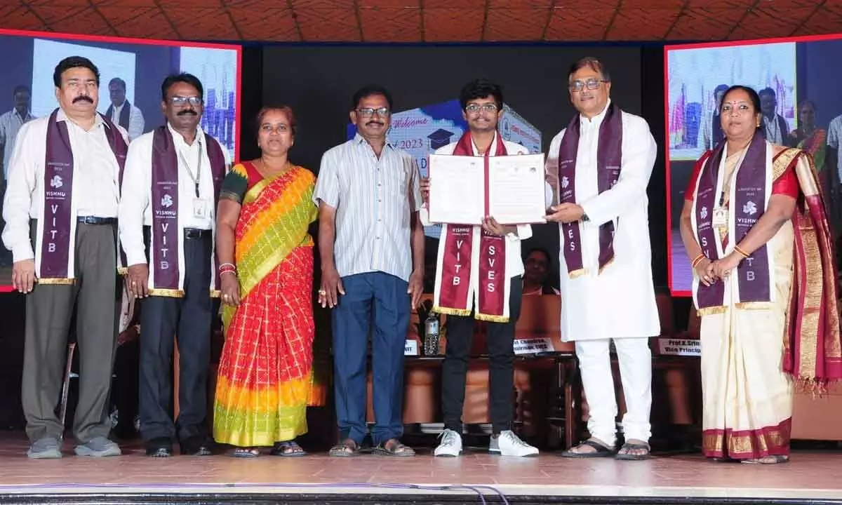 Vice-Chairman of Sri Vishnu Educational Society Ravichandran Rajagopal presenting certificates to students in Bhimavaram on Sunday