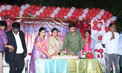 Municipal Commissioner Vikas Marmat cutting a cake along with Mayor P Sravanthi Jayavardhan on Christmas at Nellore municipal corporation office on Monday
