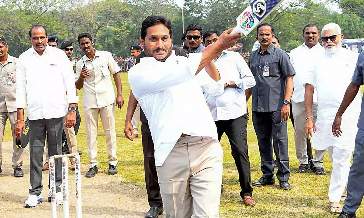 Chief Minister YS Jagan Mohan Reddy plays cricket during the inauguration of the Aadudam Andhra 2023 sports festival, in Guntur on Tuesday