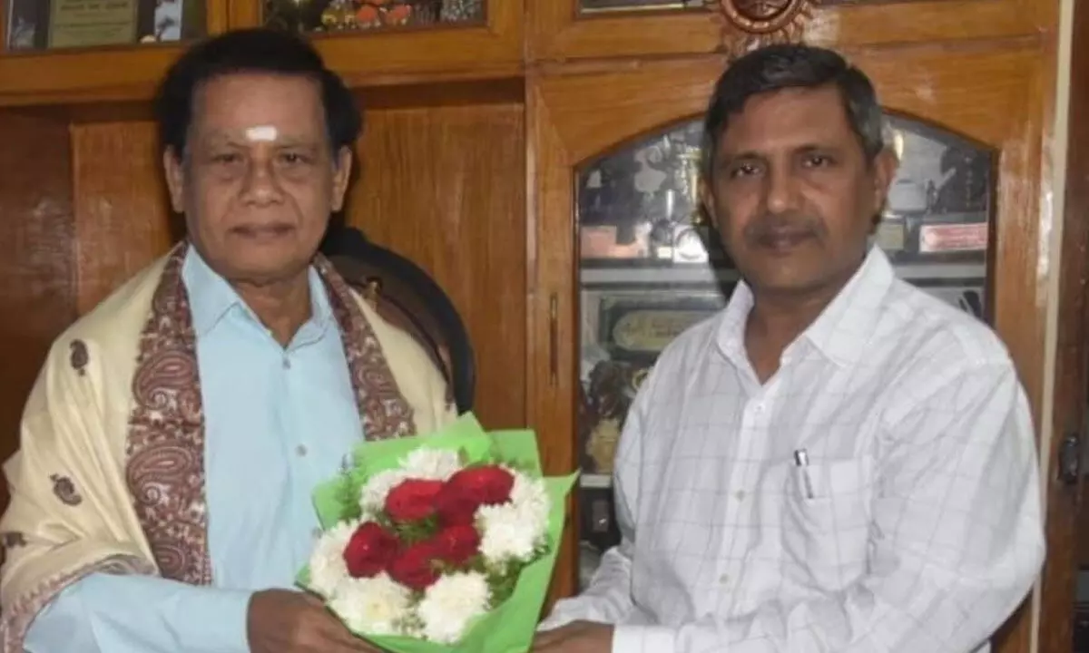 I&PR official Maniram congratulating Dr Migada Ramalinga Swmay in Visakhapatnam on Tuesday