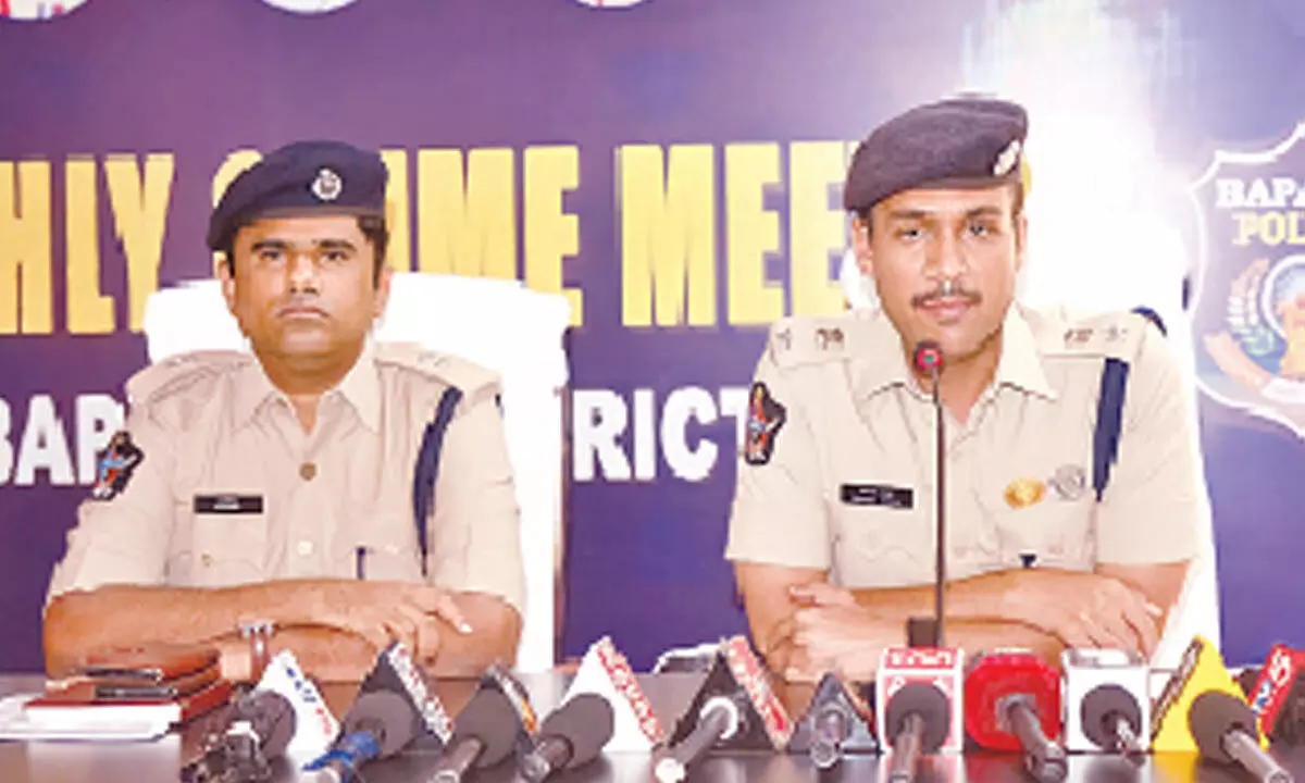 Bapatla SP Vakul Jindal, additional SP P Mahesh participating in annual crime report press meet in Bapatla on Tuesday